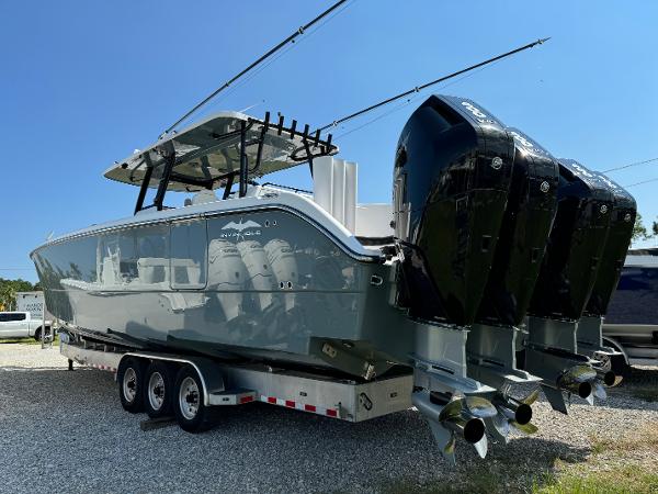 Slide: The Image of 2024 Invincible 40 Catamaran with triple outboard engines on a trailer. - 5