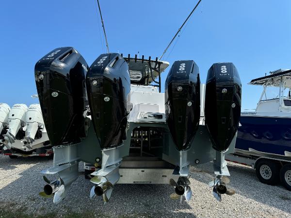 Slide: The Image of 2024 Invincible 40 Catamaran with four powerful outboard engines, rear view. - 6