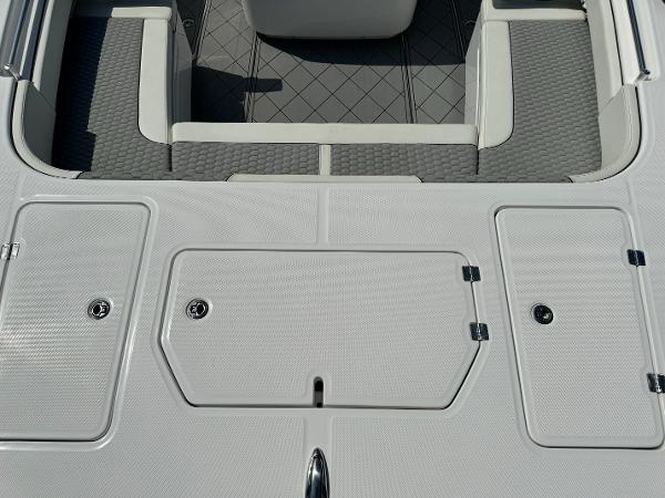 Slide: The Image of 2024 Invincible 40 Catamaran deck with storage compartments and seating area. - 9