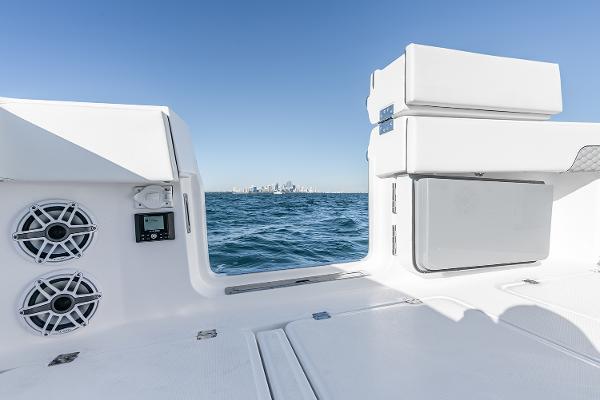 Slide: The Image of Invincible 46 Catamaran 2026 interior with ocean view, featuring speakers and storage. - 10