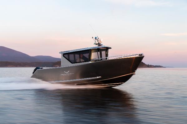Slide: The Image of 2025 Jasper Marine Defender 22 boat cruising on calm waters at sunset. - 2