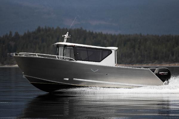 Slide: The Image of 2025 Jasper Marine Defender 22 boat cruising on a lake. - 21