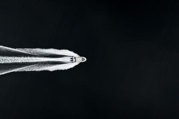 Slide: The Image of Aerial view of 2025 Jasper Marine Defender 22 boat speeding on water. - 37