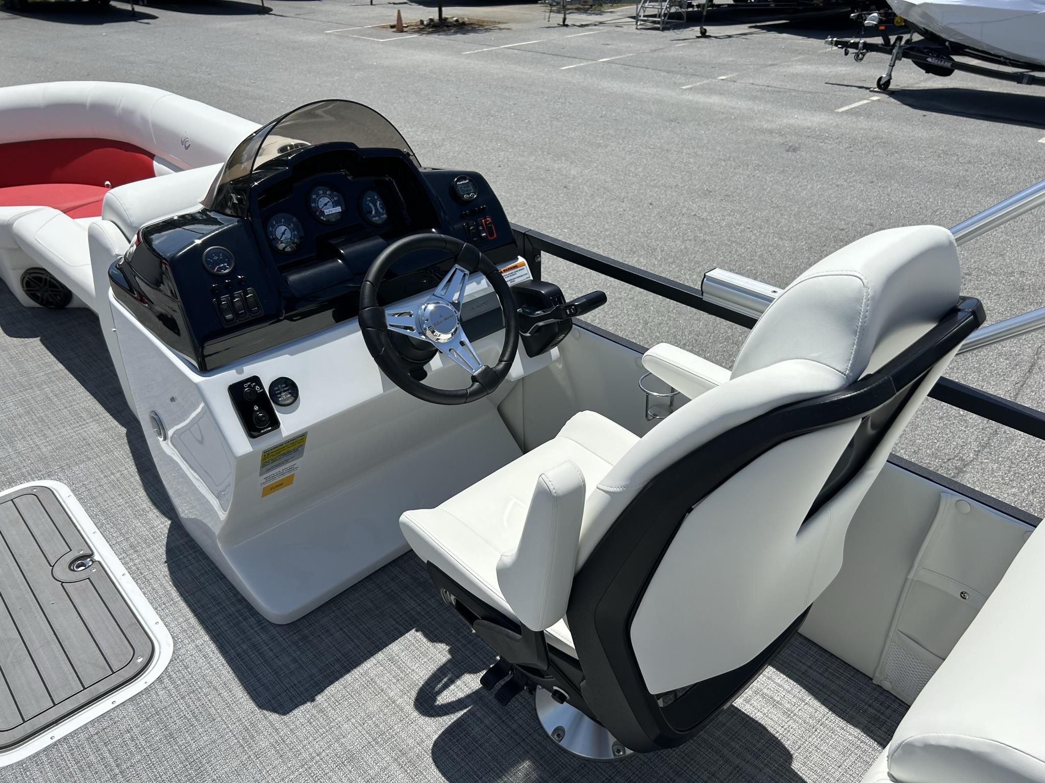 Slide: The Image of 2024 JC 247 TT boat helm with white captain's chair and control panel. - 13