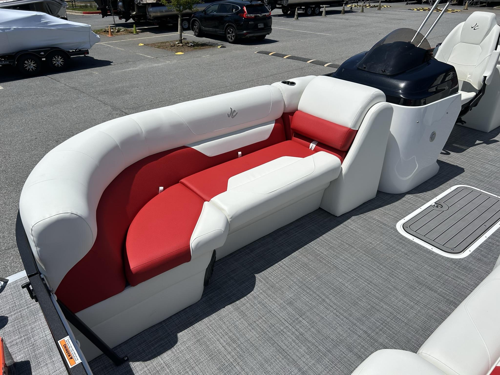 Slide: The Image of 2024 JC 247 TT boat interior with red and white seating, Suzuki 250HP engine. - 2