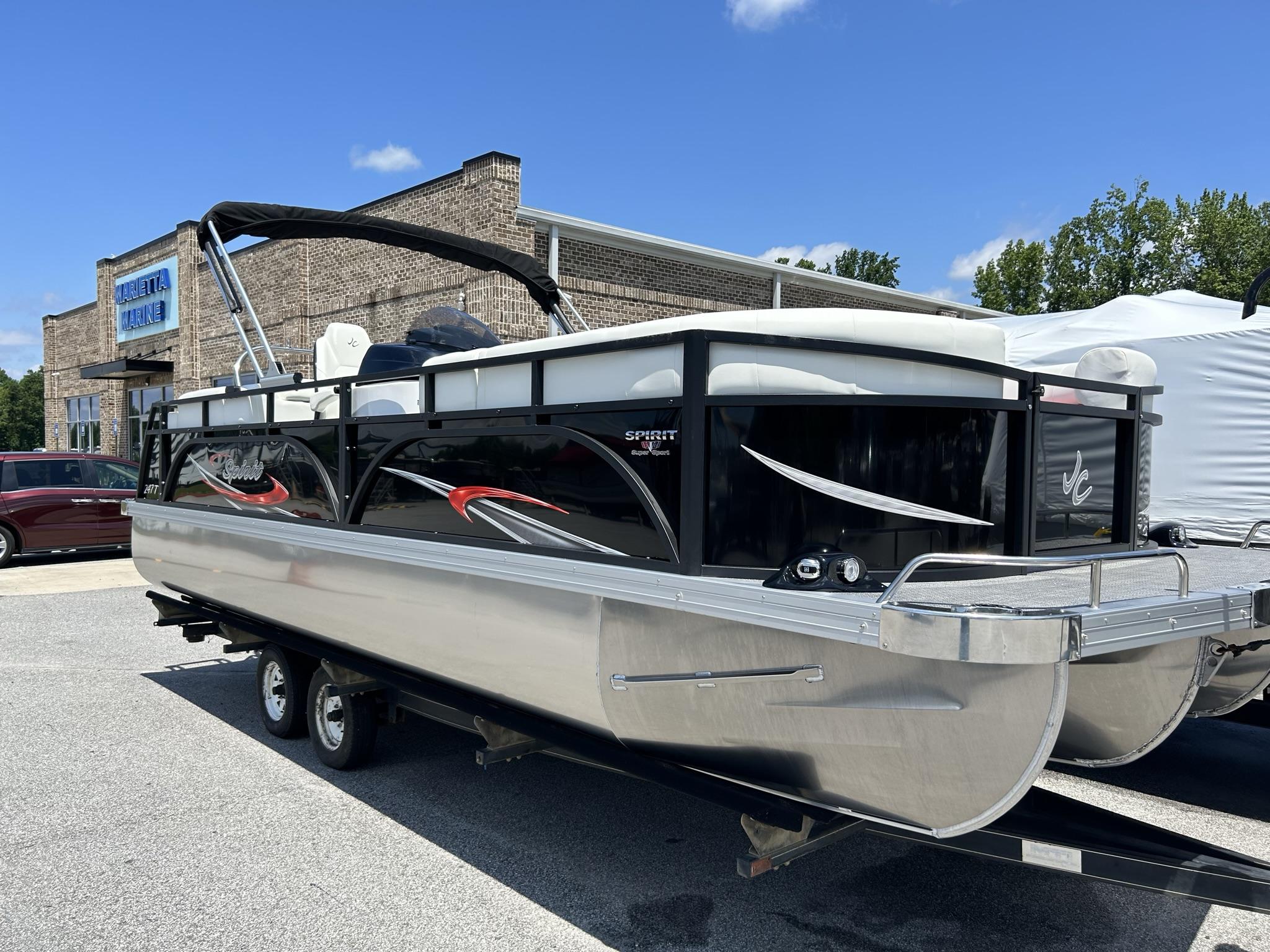 Slide: The Image of 2024 JC 247 TT - DSL Sport pontoon boat with Suzuki 250HP engine at dealership. - 26