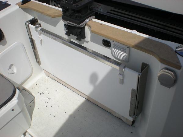 Slide: The Image of 2019 Jeanneau 695 boat interior, featuring a foldable table and seating area. - 12
