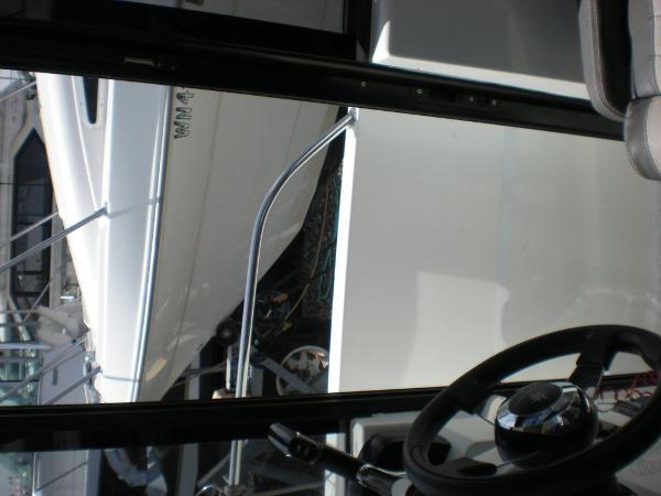 Slide: The Image of Interior view of 2019 Jeanneau 695 boat with steering wheel. - 13