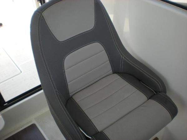 Slide: The Image of Gray and black seat in 2019 Jeanneau 695 boat interior. - 14