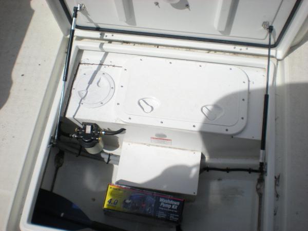 Slide: The Image of Storage compartment of 2019 Jeanneau 695 boat with equipment and pump kit. - 7