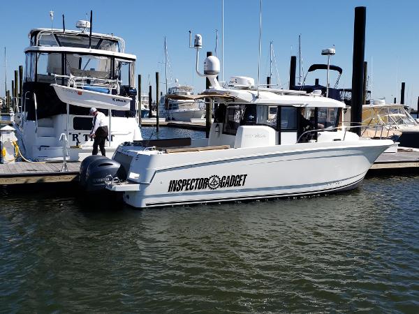 Slide: The Image of 2016 Jeanneau Merry Fisher 855 docked at marina, named Inspector Gadget. - 0