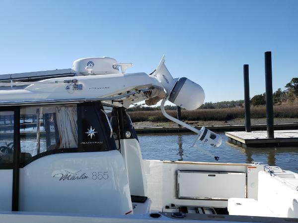 Slide: The Image of 2016 Jeanneau Merry Fisher 855 docked at a marina. - 16