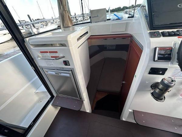 Slide: The Image of Interior of 2016 Jeanneau Merry Fisher 855 boat with cabin and kitchenette. - 19