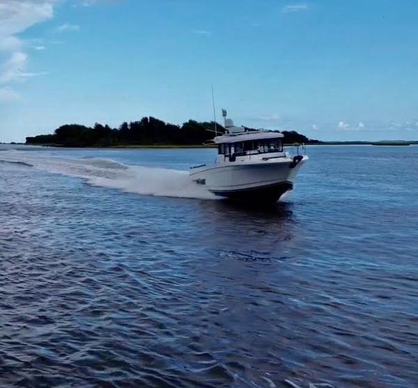 Slide: The Image of 2016 Jeanneau Merry Fisher 855 cruising on open water. - 2