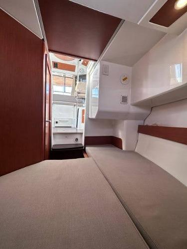 Slide: The Image of 2016 Jeanneau Merry Fisher 855 cabin interior with modern design and comfortable seating. - 21