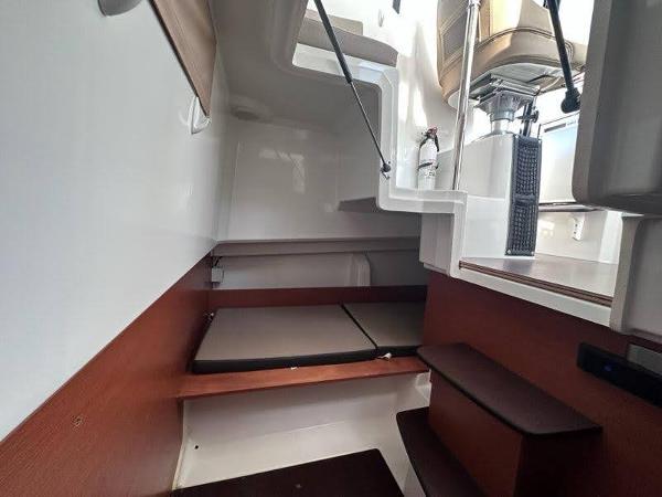 Slide: The Image of 2016 Jeanneau Merry Fisher 855 interior cabin with stairs and seating area. - 22