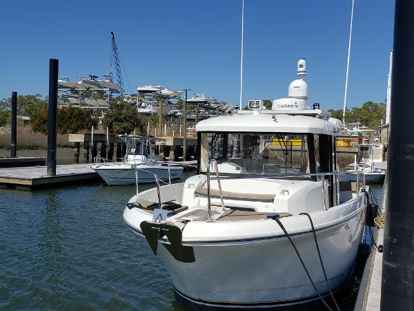 Slide: The Image of 2016 Jeanneau Merry Fisher 855 docked at marina. - 3
