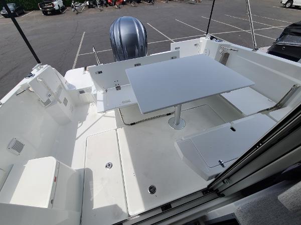 Slide: The Image of 2021 Jeanneau NC 795 S2 boat deck with seating and table. - 10