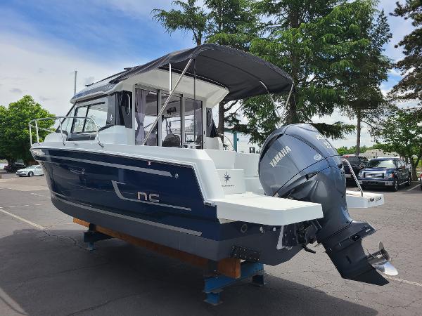 Slide: The Image of 2021 Jeanneau NC 795 S2 boat with Yamaha outboard motor. - 2
