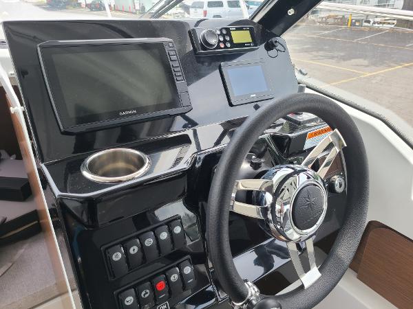 Slide: The Image of 2021 Jeanneau NC 795 S2 helm with Garmin navigation system and modern controls. - 5