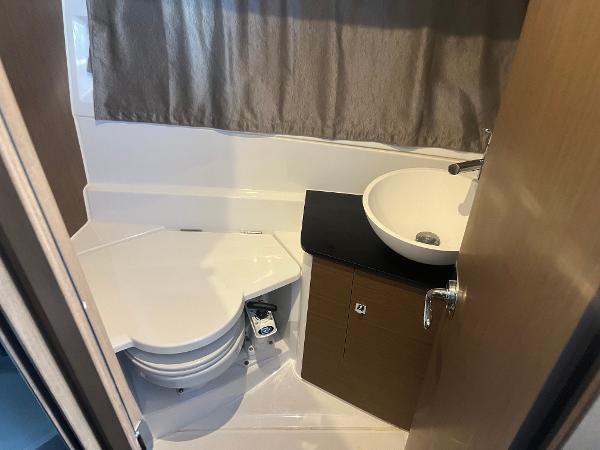 Slide: The Image of 2020 Jeanneau NC 895 bathroom with sink and toilet. - 12