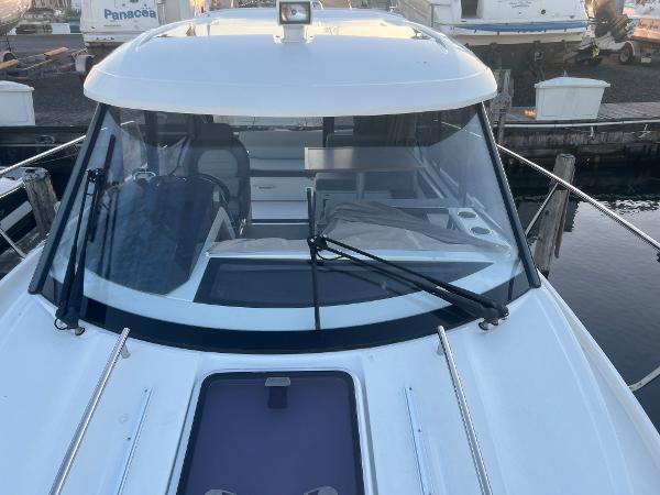 Slide: The Image of 2020 Jeanneau NC 895 boat, front view with windshield and deck details. - 5