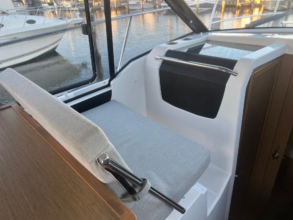 Slide: The Image of Interior seating area of 2020 Jeanneau NC 895 boat, featuring modern design and waterfront view. - 7