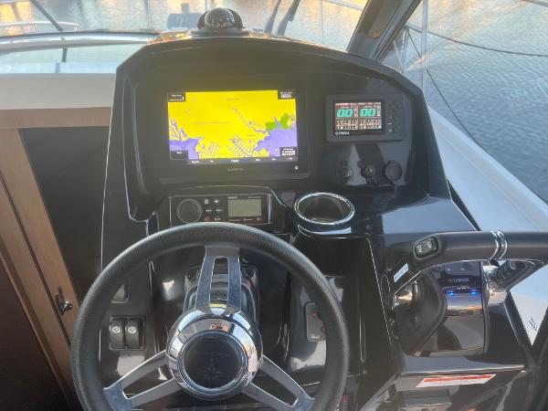 Slide: The Image of 2020 Jeanneau NC 895 helm with navigation display and controls. - 9