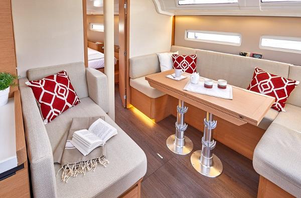 Slide: The Image of Luxurious interior of 2026 Jeanneau Sun Odyssey 410 yacht with cozy seating and elegant decor. - 10