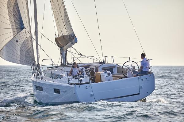 Slide: The Image of 2026 Jeanneau Sun Odyssey 410 sailing on open water, showcasing sleek design and performance. - 22
