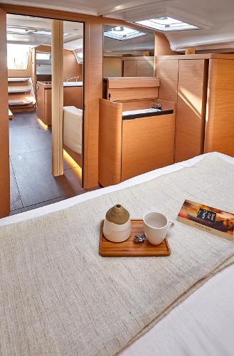 Slide: The Image of Interior of 2026 Jeanneau Sun Odyssey 410 yacht, featuring cozy cabin and modern design. - 9