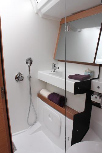 Slide: The Image of Modern bathroom in 2024 Jeanneau Sun Odyssey 440 yacht, featuring sleek design and amenities. - 11