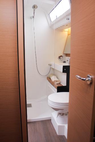 Slide: The Image of 2024 Jeanneau Sun Odyssey 440 bathroom with modern fixtures and wooden accents. - 27
