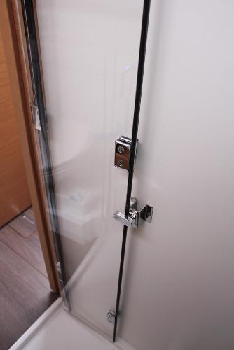 Slide: The Image of 2024 Jeanneau Sun Odyssey 440 interior shower door with modern chrome handle. - 28