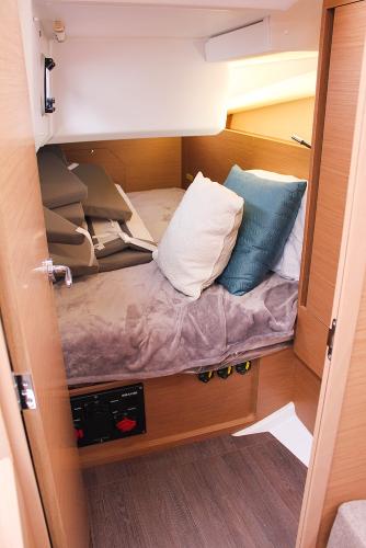 Slide: The Image of 2024 Jeanneau Sun Odyssey 440 cabin with cozy bedding and modern design. - 31