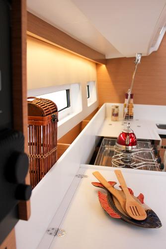 Slide: The Image of 2024 Jeanneau Sun Odyssey 440 galley with modern design and wooden utensils. - 36