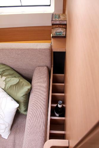 Slide: The Image of Interior of 2024 Jeanneau Sun Odyssey 440 yacht with cozy seating and built-in storage. - 38