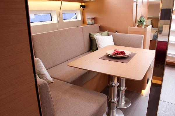 Slide: The Image of Interior of 2024 Jeanneau Sun Odyssey 440 yacht with cozy seating and dining area. - 42