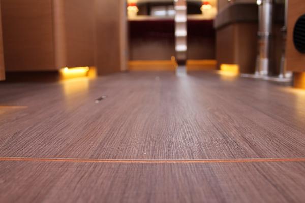 Slide: The Image of Interior view of 2024 Jeanneau Sun Odyssey 440 yacht, featuring elegant wooden flooring. - 44