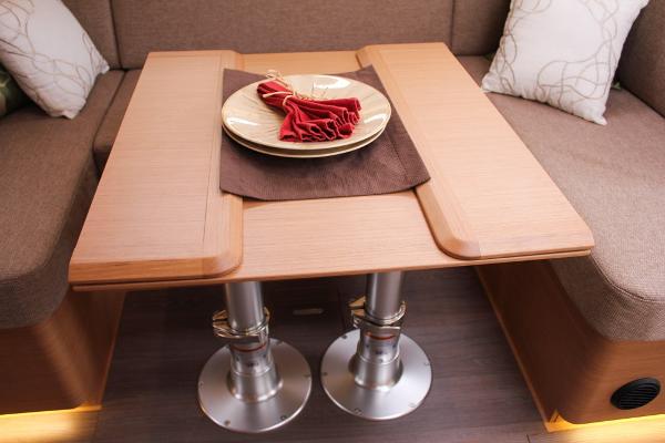 Slide: The Image of Interior of 2024 Jeanneau Sun Odyssey 440 with elegant wooden table and cozy seating. - 47