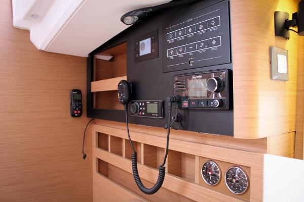Slide: The Image of 2024 Jeanneau Sun Odyssey 440 navigation panel with communication equipment and control gauges. - 7