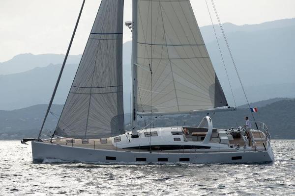 Slide: The Image of 2025 Jeanneau Yacht 65 sailing on open water. - 0