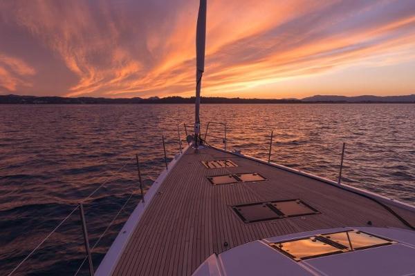 Slide: The Image of Jeanneau Yacht 65 sailing at sunset, 2025 model. - 1