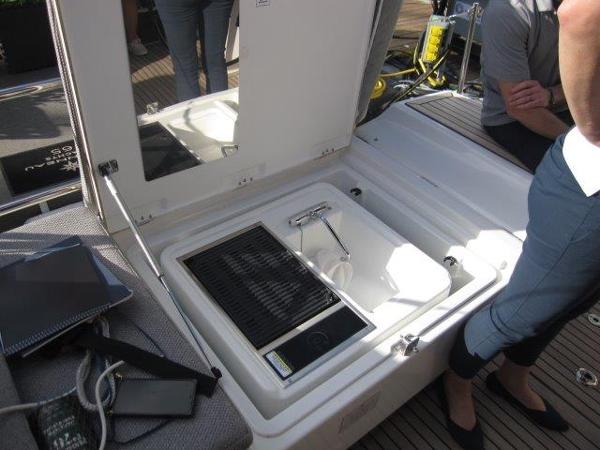 Slide: The Image of 2025 Jeanneau Yacht 65 interior with open storage compartment. - 13