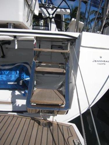 Slide: The Image of Jeanneau Yacht 65 (2025) with foldable wooden steps and sleek design. - 15