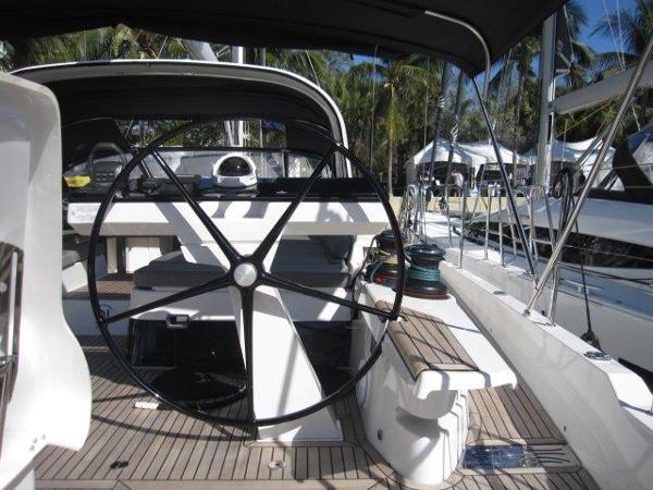 Slide: The Image of 2025 Jeanneau Yacht 65 cockpit with steering wheel and deck view. - 16
