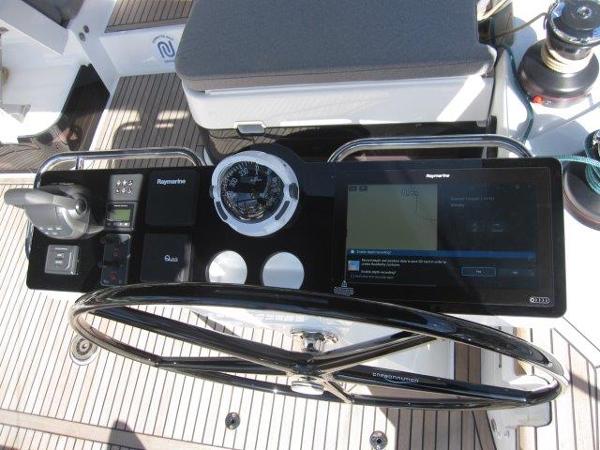 Slide: The Image of Jeanneau Yacht 65 2025 steering console with navigation instruments and touchscreen display. - 19