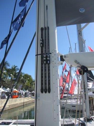 Slide: The Image of 2025 Jeanneau Yacht 65 mast and rigging at a marina. - 31