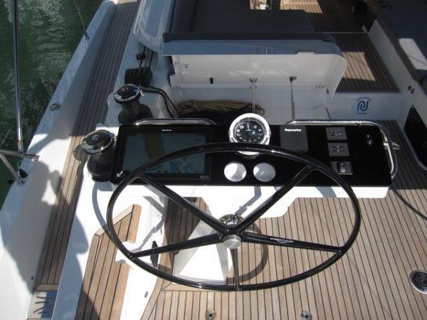 Slide: The Image of Steering console of the 2025 Jeanneau Yacht 65 with navigation instruments. - 37