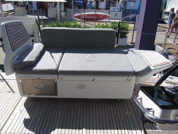 Slide: The Image of Jeanneau Yacht 65 (2025) deck with cushioned seating and storage compartments. - 38